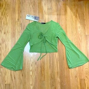 Light green Micas top with flared sleeves and a bow.
